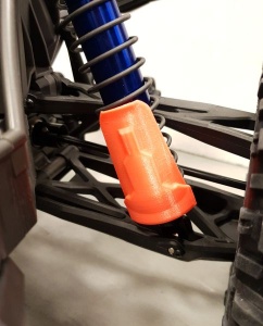 Auslauf - JS-Parts Kolbenschützer für Traxxas X-Maxx orange
